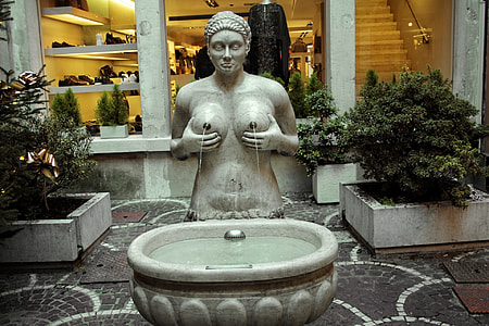 woman fountain statue near building thumbnail