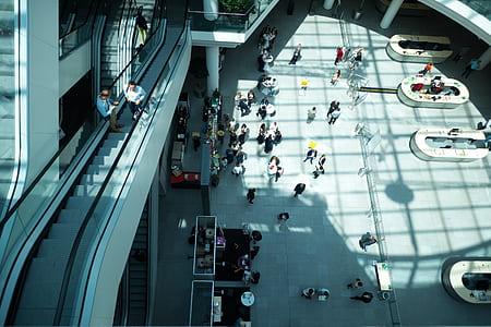 group of people walking through building thumbnail