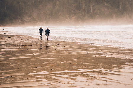 two man running on seashores thumbnail