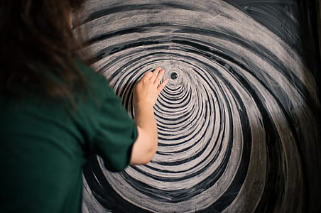 person painting on gray board thumbnail