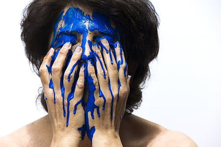 person make face blue paint thumbnail