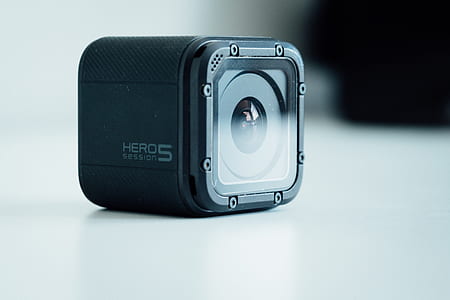 black GoPro HERO 5 Session on white surface thumbnail
