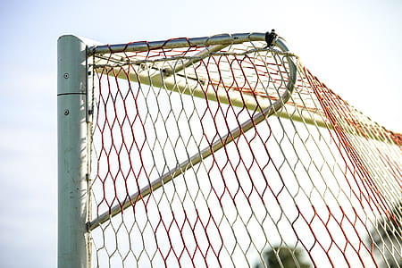 macro shot of gray and red goal net thumbnail