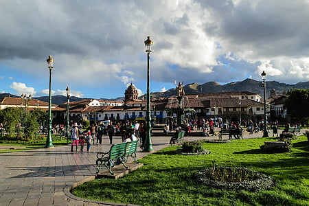 crowded park near houses thumbnail