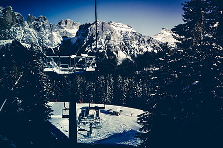 silhouette of black cable car during winter at daytime thumbnail