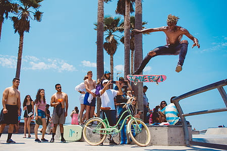 man playing skateboard up in the air thumbnail