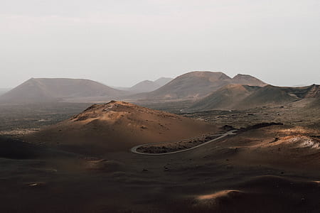 brown mountain under white cloud thumbnail