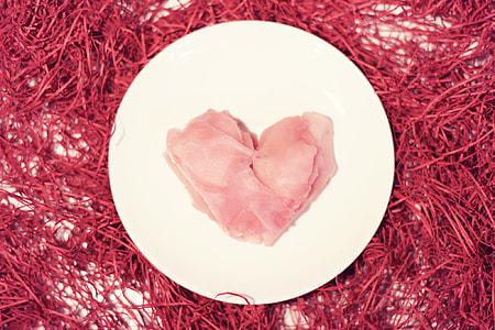 raw meat on round white ceramic plate thumbnail