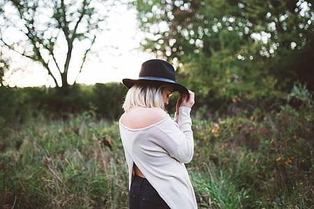 woman looking down while holding black hart thumbnail