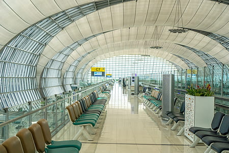 person taking photo of plane terminal interior thumbnail