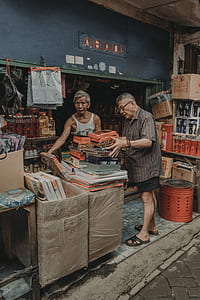 man holding boxes outside store thumbnail