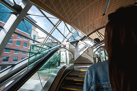 Woman on escalators at metro station thumbnail