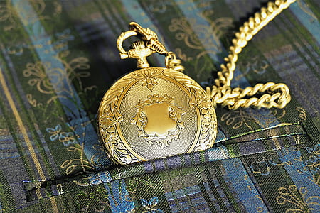 round gold-colored pocket watch thumbnail