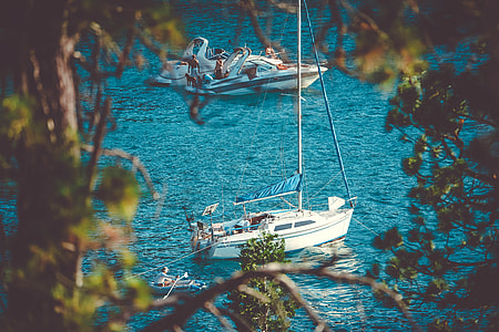 two white yacht on body of water thumbnail