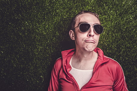 man wearing red zip-up jacket and black aviator sunglasses thumbnail