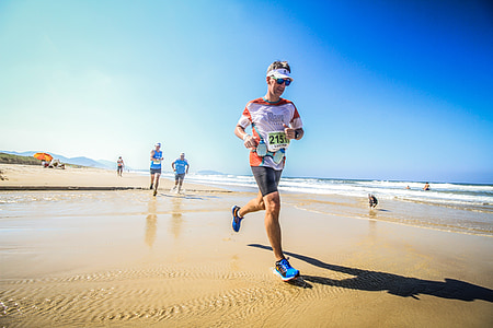 man running near body of water thumbnail