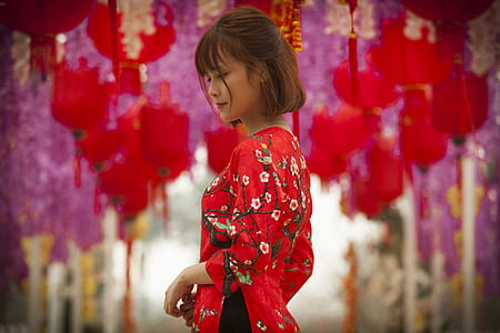 Woman in Red and White Floral Cheonsam Smiling thumbnail