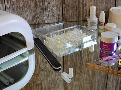 clear organizer container beside black nail pile thumbnail