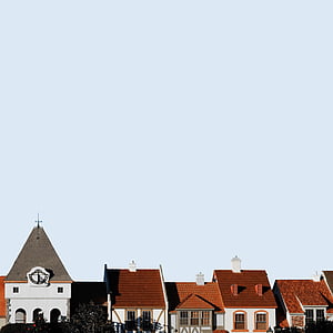brown and white houses under blue cloudy sky thumbnail