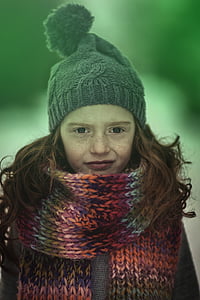 selective focus photo of girl wearing scarf and bobble cap thumbnail