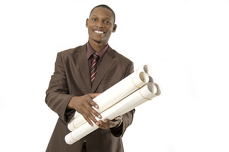 person in brown notch lapel suit jacket carrying blueprints thumbnail