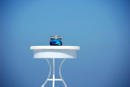 blue glass jar on wooden table thumbnail