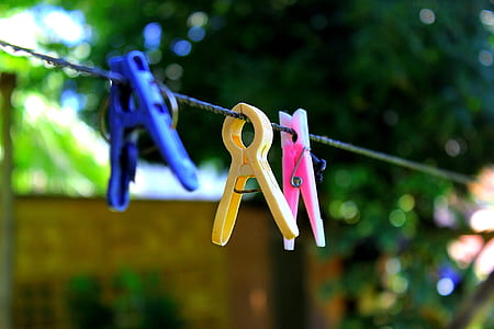 three assorted-color clips on hanger thumbnail