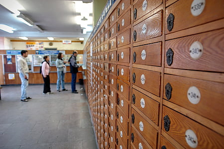four person standing in front of locker inside room thumbnail