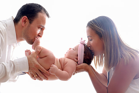 man and woman holding baby thumbnail