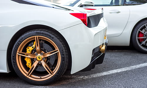 closeup photograhy of white Ferrari 458 Italia during daytime thumbnail