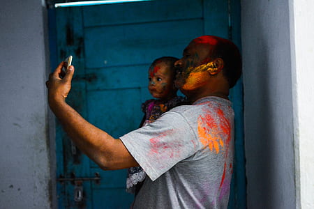 man carrying his child thumbnail