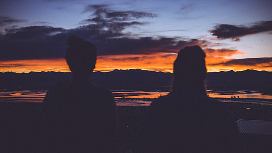 silhouette photo of people staring at golden hour thumbnail