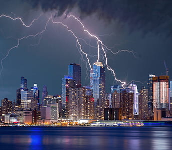 city at night during thunder storm thumbnail