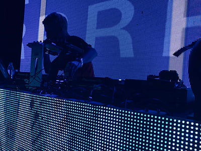 DJ performing on stage thumbnail