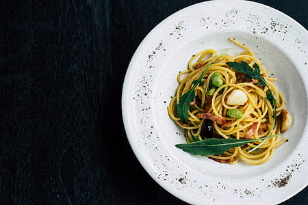 pasta with scallop and basil on white ceramic plat thumbnail