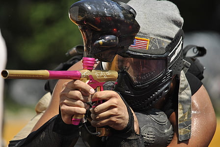 man holding paintball gun thumbnail