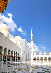 person taking photo of white mosque thumbnail