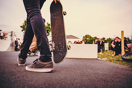 person holding skateboard thumbnail