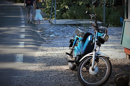 blue underbone motorcycle beside of road thumbnail