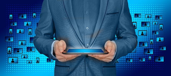 person wearing suit holding tablet computer thumbnail