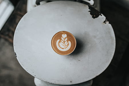 coffee in white ceramic cup on table thumbnail
