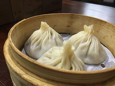 three dumplings in brown container thumbnail