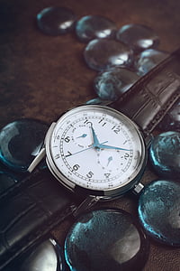 round silver-colored analog watch at 10:09 thumbnail