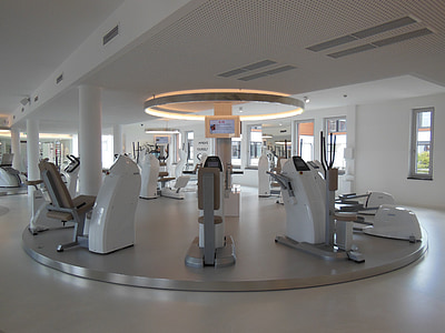 gray and white exercise equipments inside room thumbnail