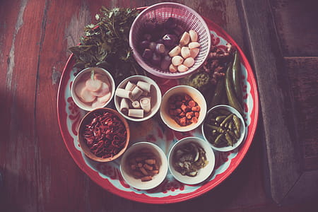 Assorted Spices on White and Red Plate on Brown Wooden Table thumbnail