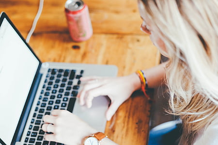 woman using MacBook Pro thumbnail