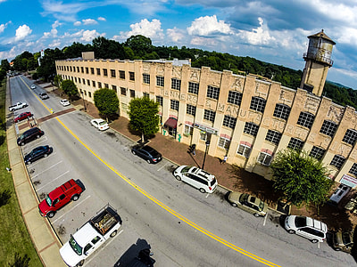 bird's eye photography of parked vehicles near building thumbnail