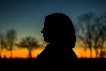 Silhouette of a Person during Sunset thumbnail