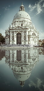 white concrete dome structure with reflection on water thumbnail