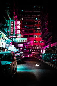 parked cars near high-rise buildings taken during night time thumbnail